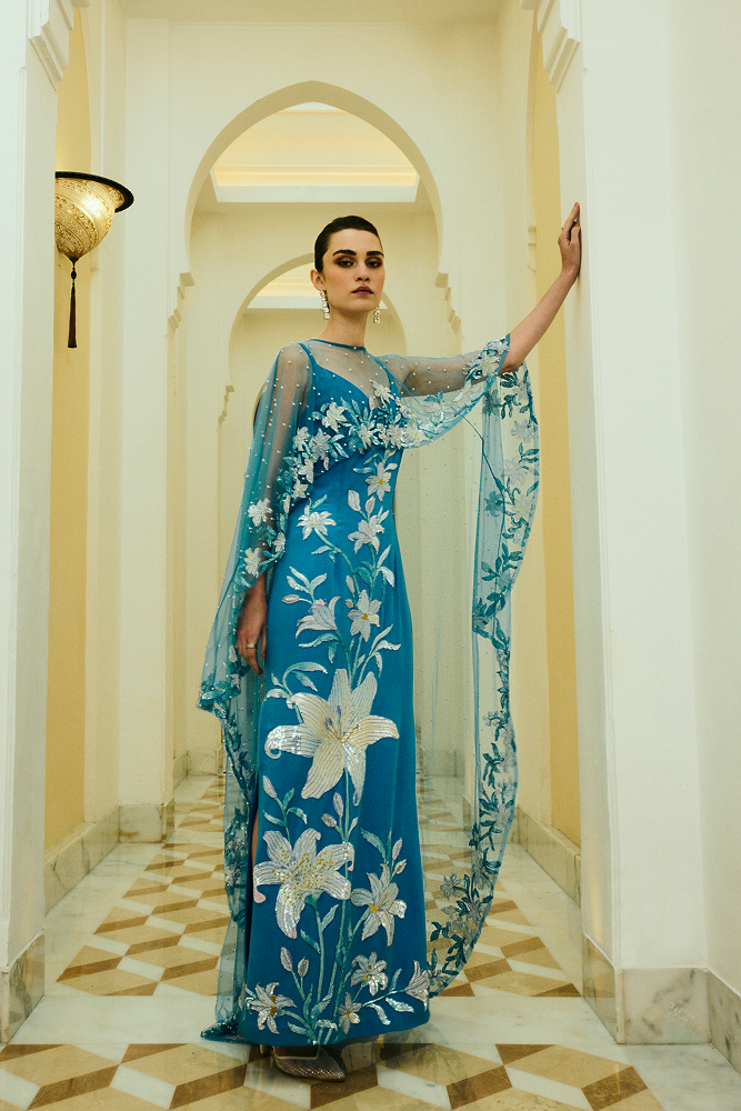 3D floral applique dress featuring a high neck sheer capelet overlay