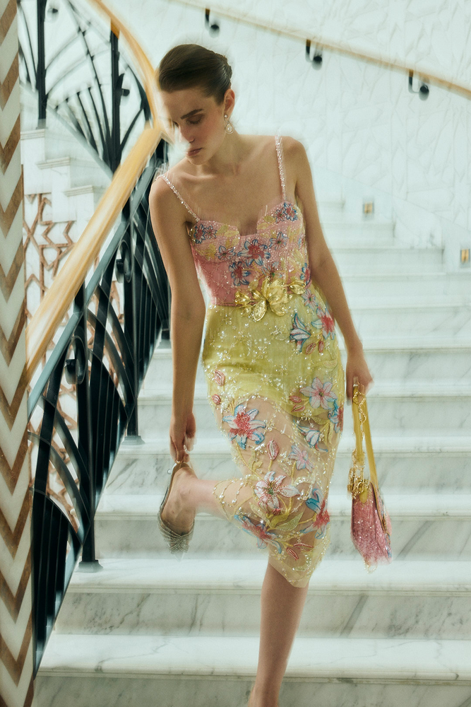 Couture handwork dress showcasing hand-embroidered floral motifs for a destination party outfit