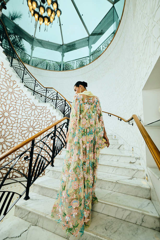 After-party cape with fitted silhouette and hand-embroidered floral motifs for a luxury event outfit