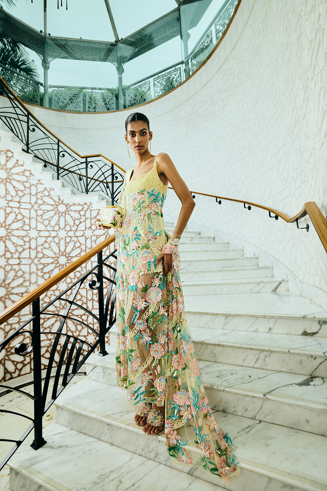 Destination party outfit styled as a fitted party dress with hand-embroidered floral motifs