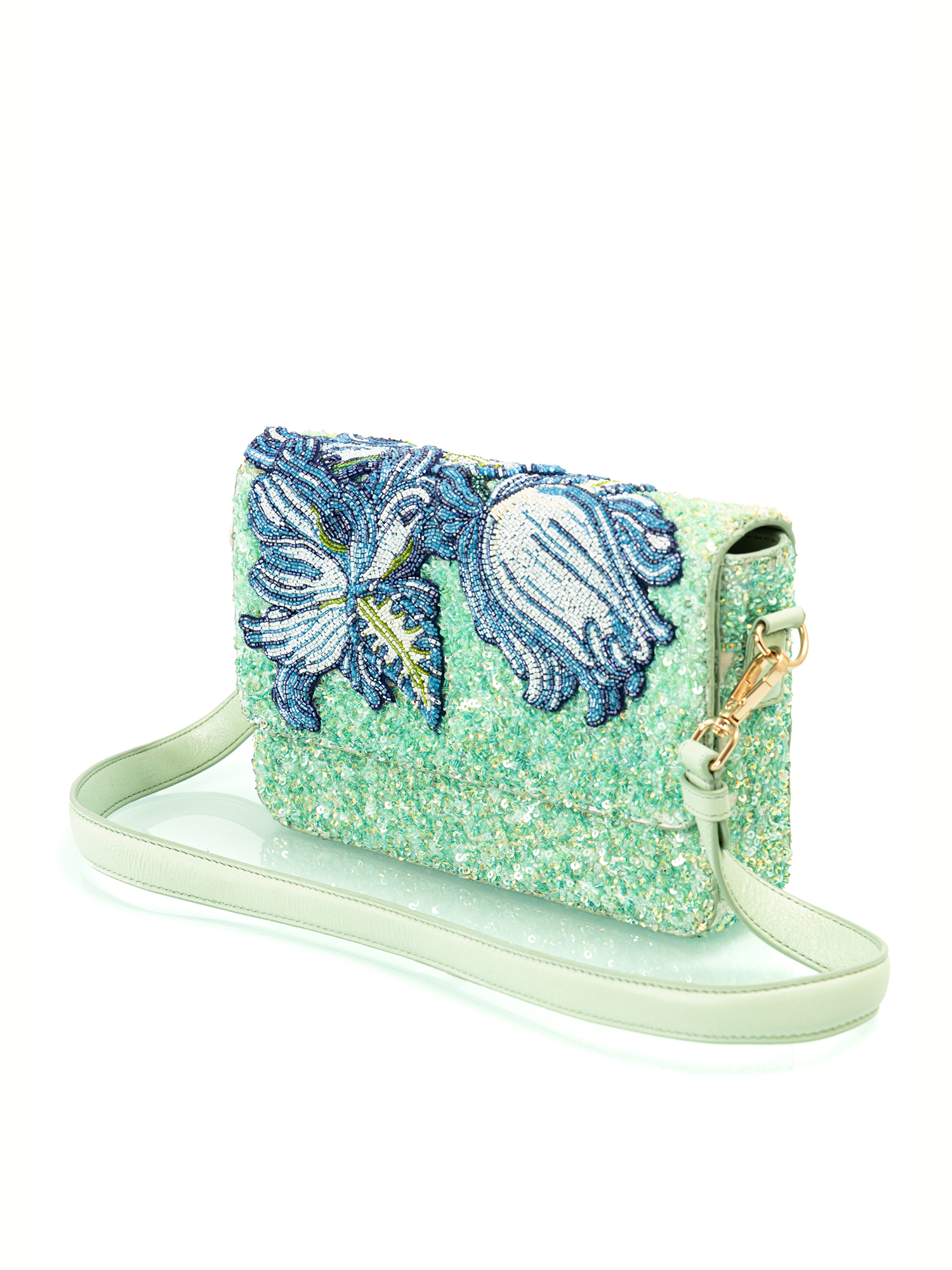 Handcrafted luxury embroidered leather bag created as a premium resort accessory for elegant parties