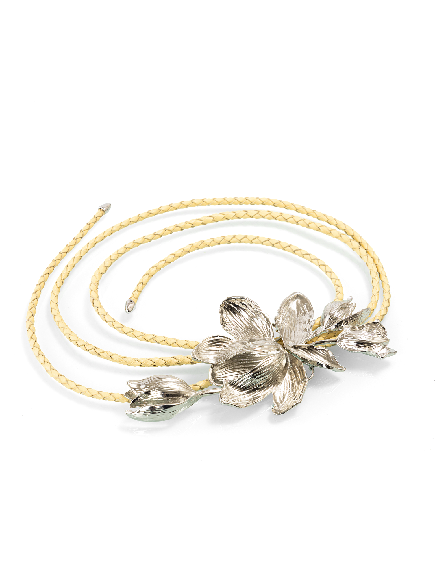 Designer braided belt featuring a floral buckle styled as a decorative layering belt for ethnic fusion looks