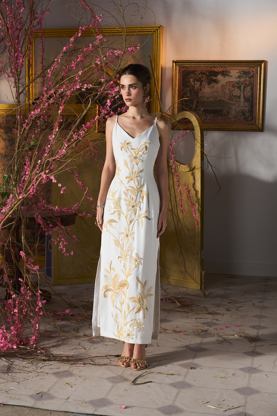 Sequin column dress in ivory with delicate floral accents, ideal for elegant evening occasions.