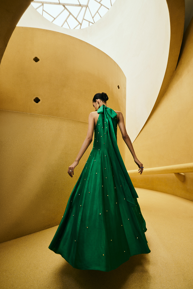 Emerald green evening gown designed as an elegant evening party gown