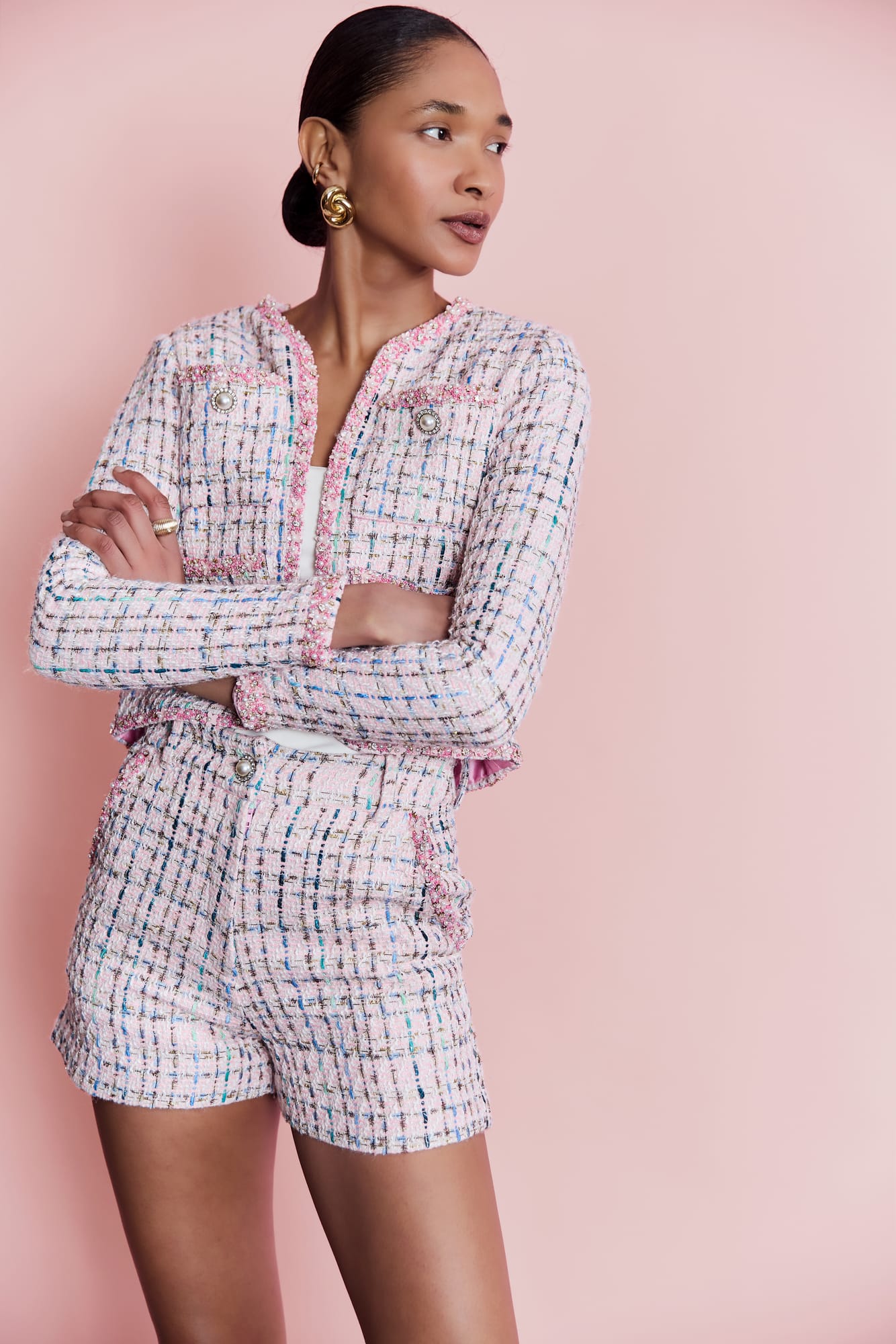 Designer high-waisted shorts in pastel pink tweed, artisanal fringe shorts with elegant beaded couture detailing