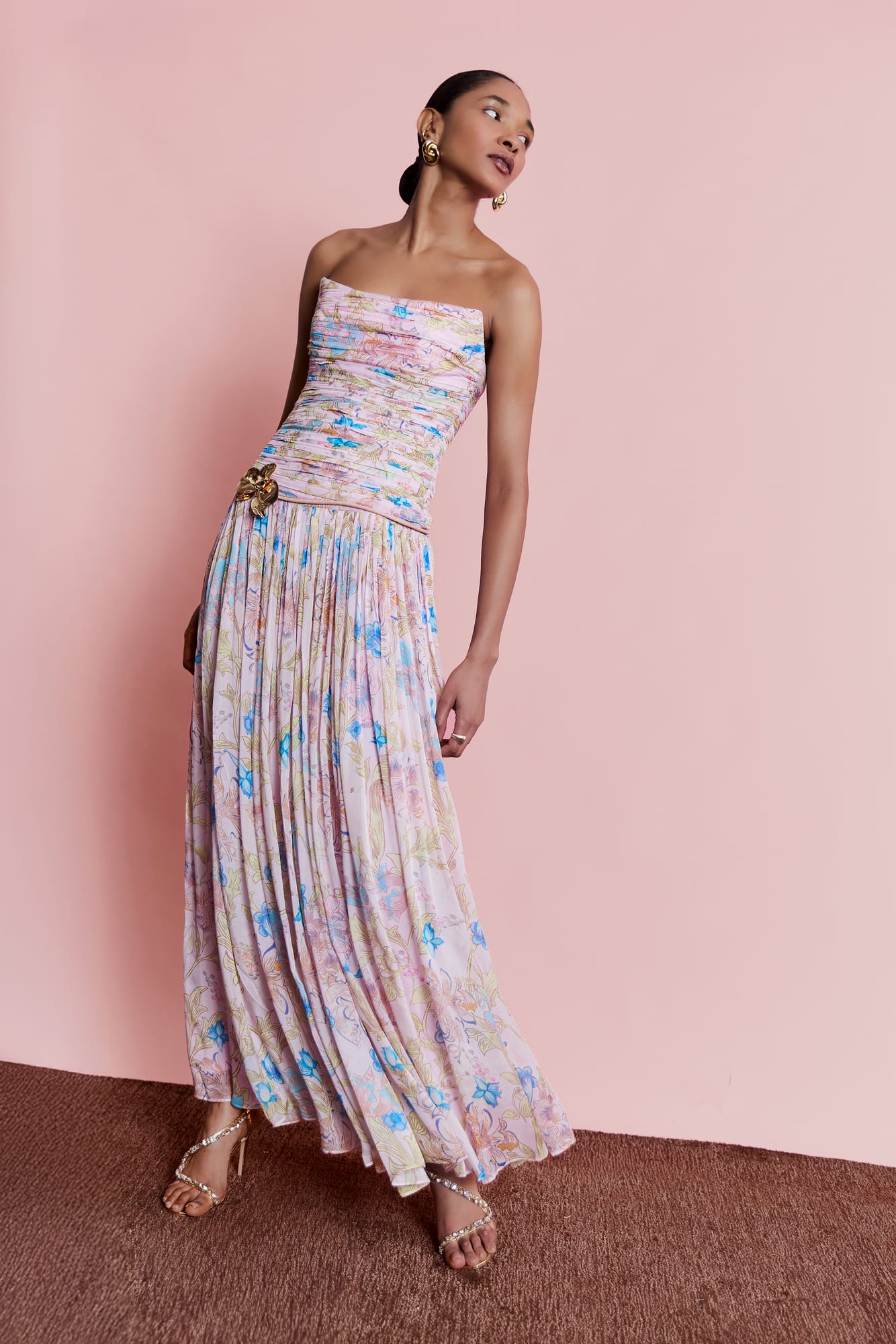 Floor-length luxury printed gown with pleated detailing, elegant strapless floral dress for garden party wear