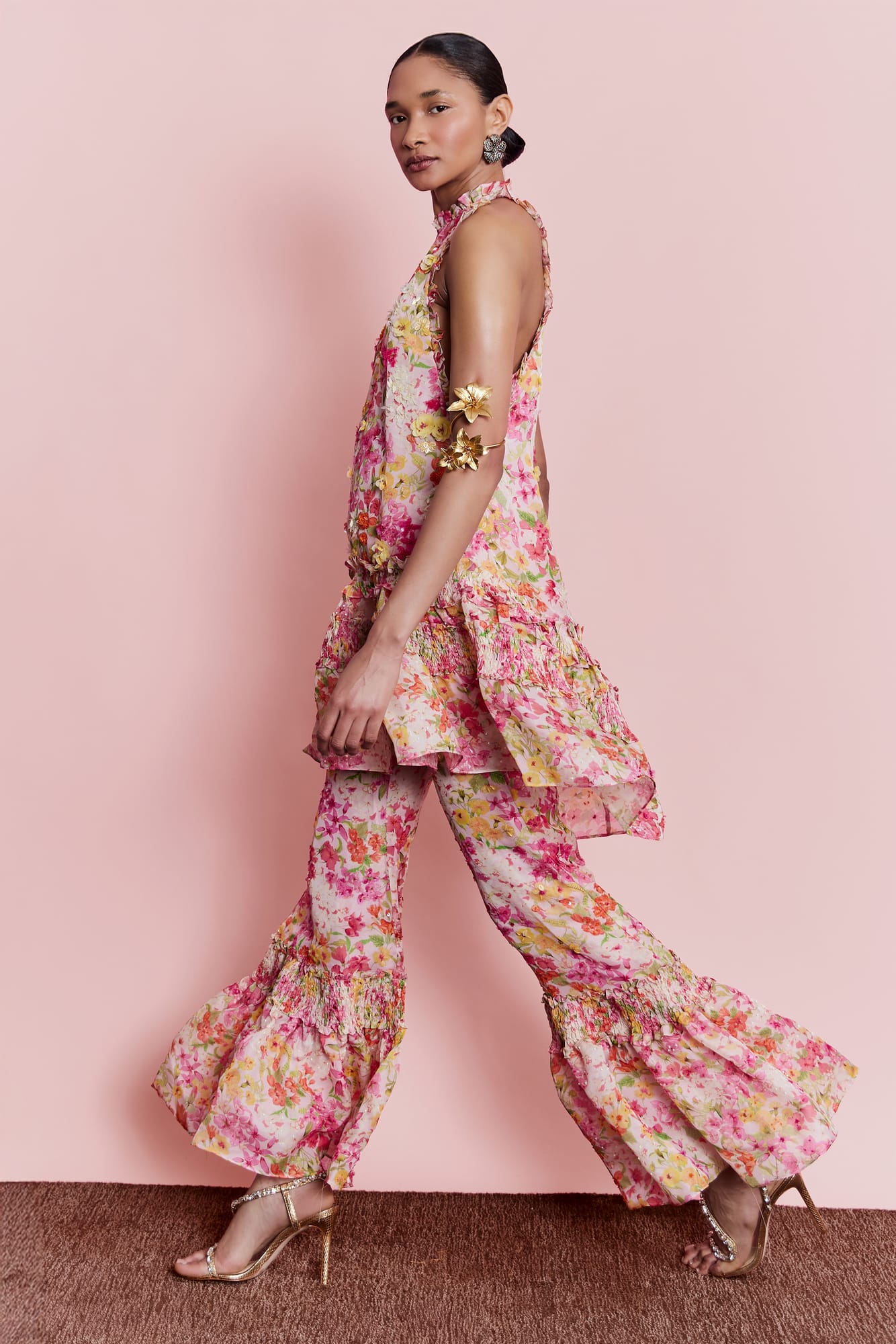 High-fashion floral pants with ruffled detailing, couture floral trousers for romantic garden party look