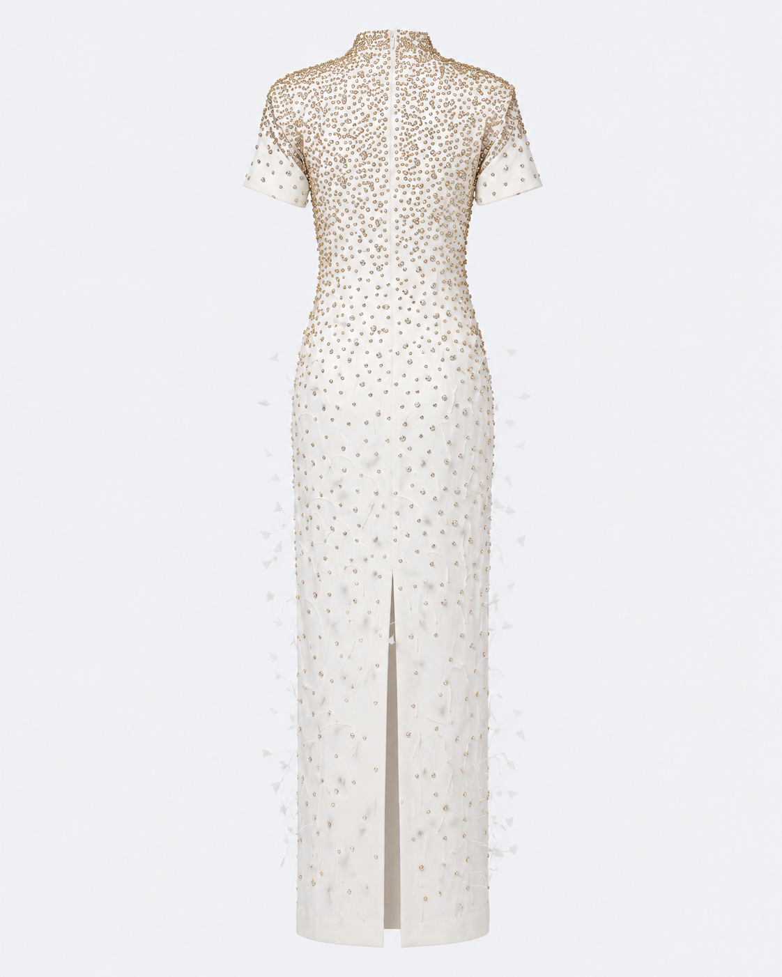 An off-white, floor-length gown with short sleeves, a high mock neck, and a front slit, heavily embellished with gold sequins and beadwork, shown against a light gray background.