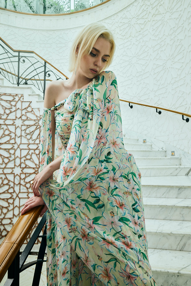 Floral cape gown featuring a sheer cape overlay for a contemporary ethnic fusion look