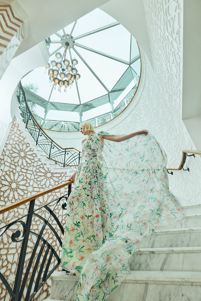 Contemporary ethnic fusion outfit showcasing a floral cape gown with tie-up cape detailing