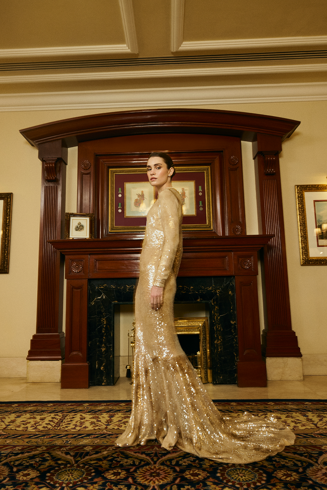 Mermaid silhouette dress crafted as a gold sequined evening gown