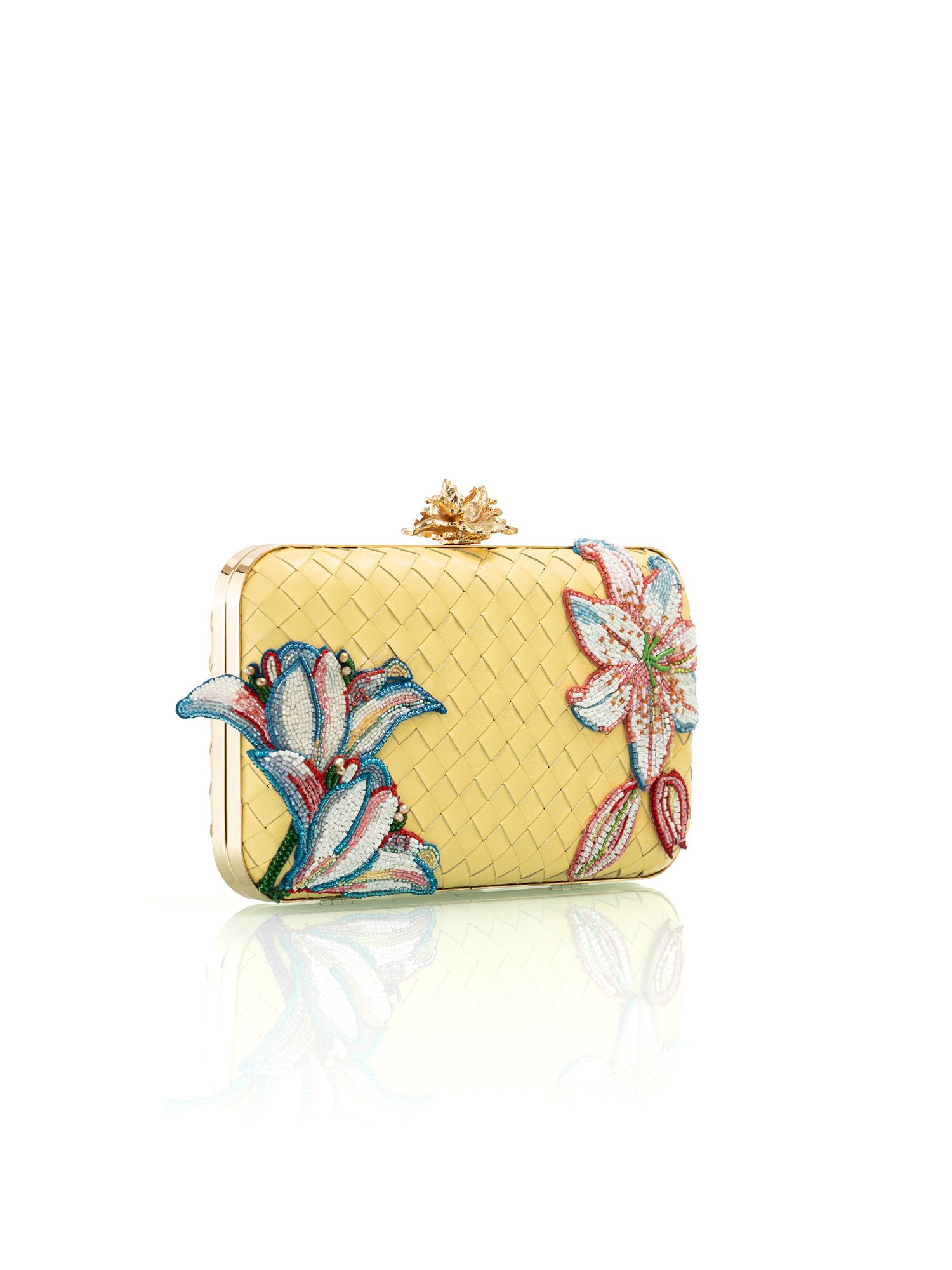Elegant butter yellow embroidered leather clutch styled for daytime and evening occasions
