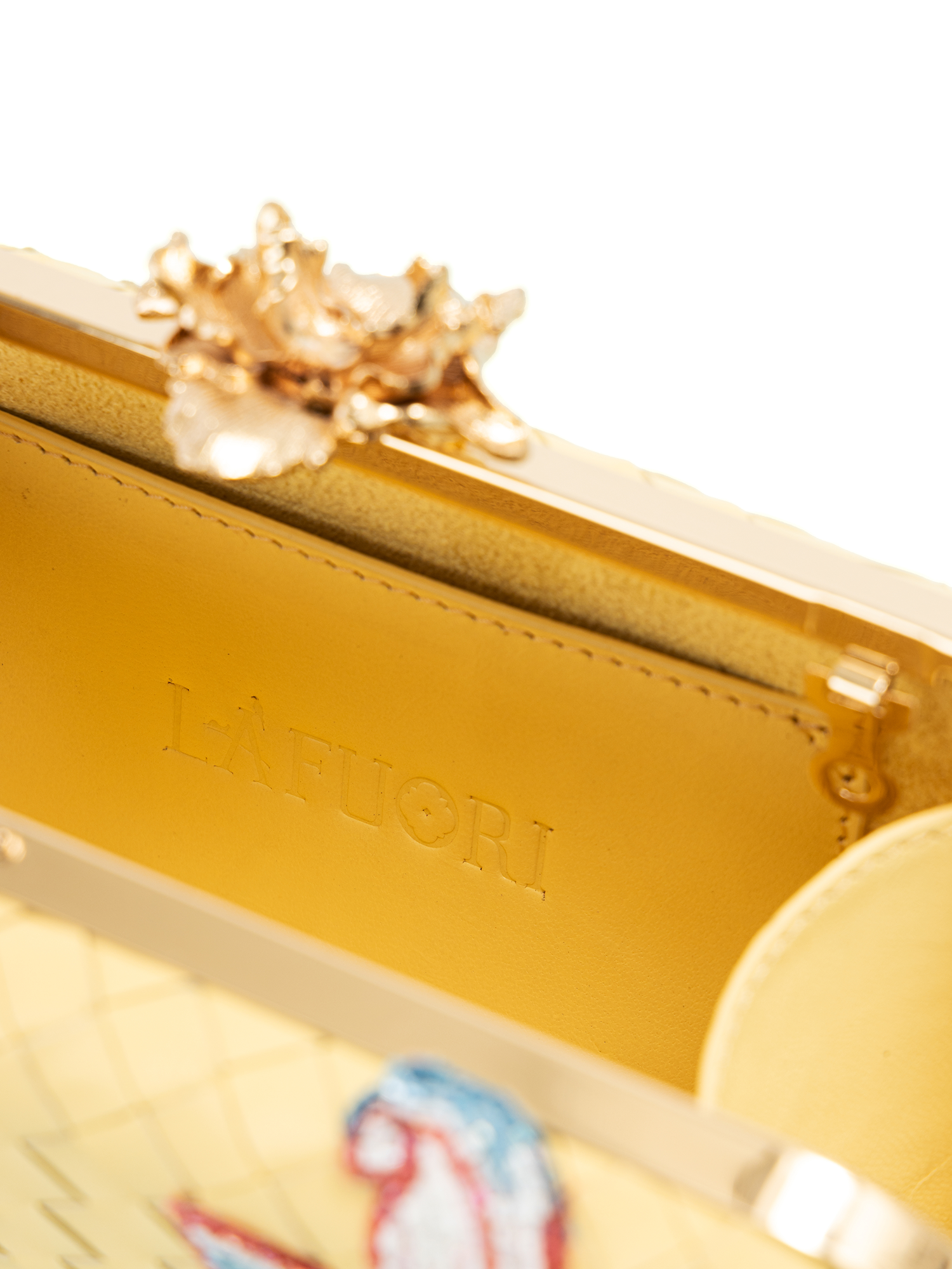 Close-up of weaved leather clutch showcasing intricate leather weaving craftsmanship
