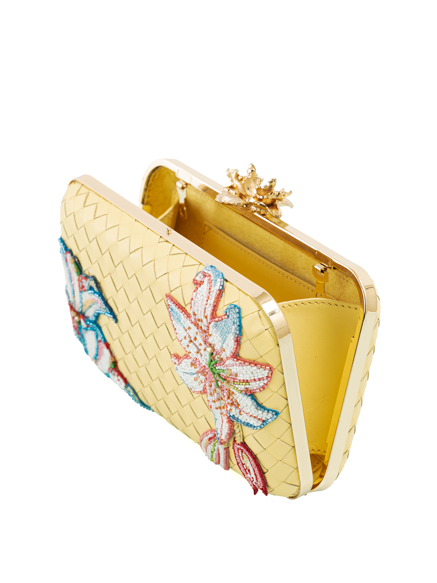 Butter yellow leather clutch featuring embroidered floral detailing and refined leather weaving
