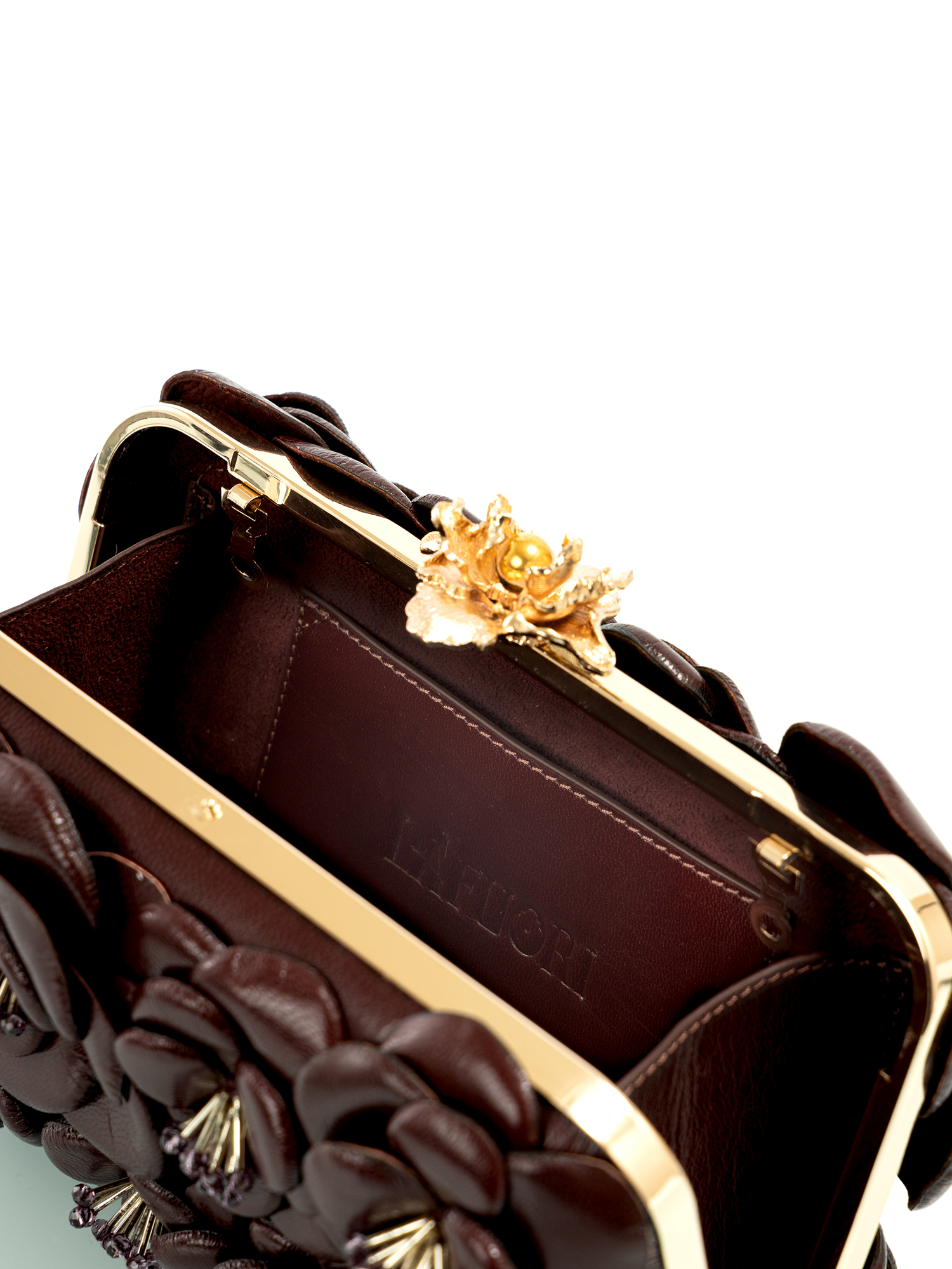 Elegant sculpted rose clutch styled as a modern party and evening bag
