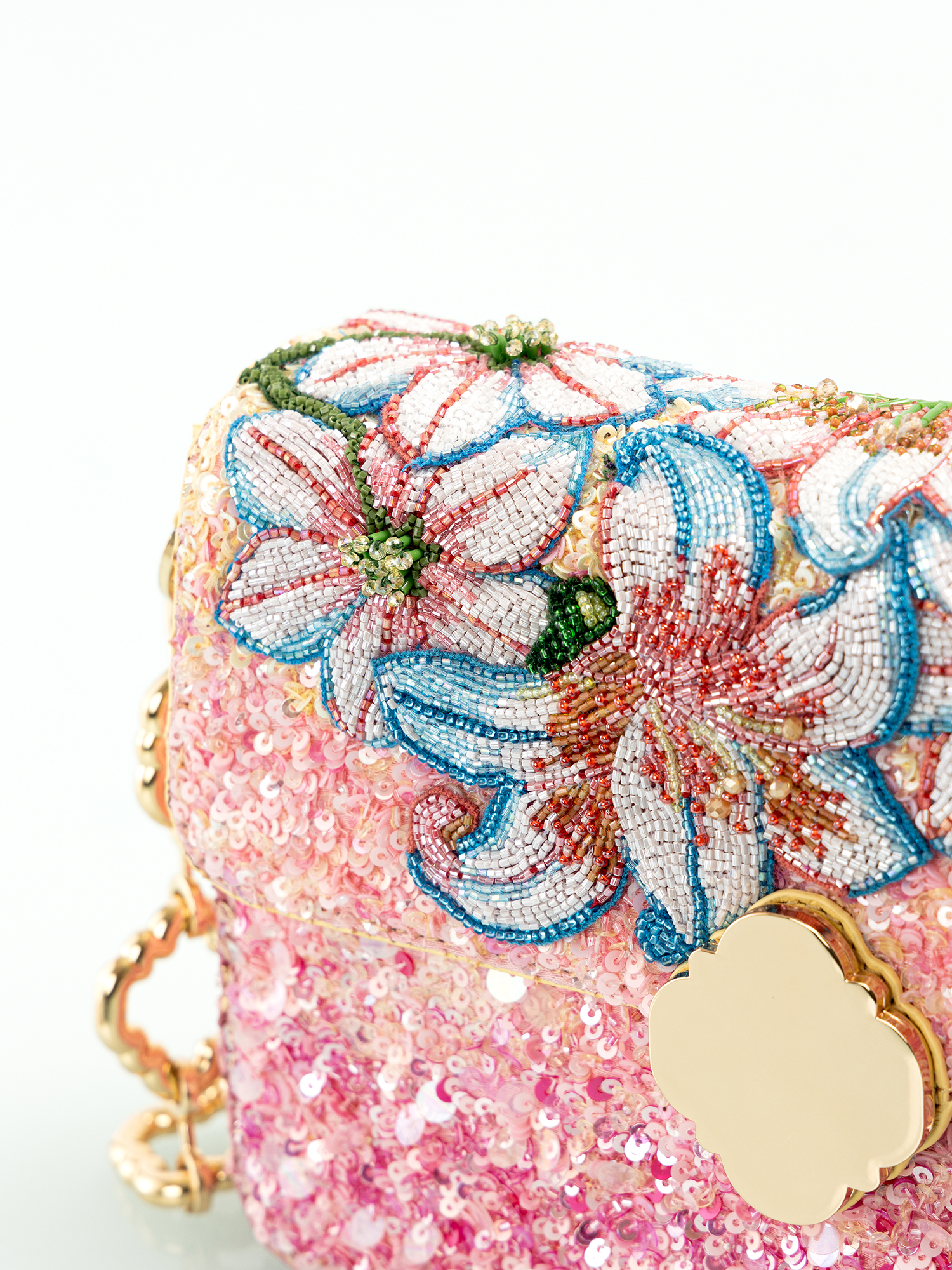 Pink embroidered leather bag with delicate floral and lily embroidery for elegant parties
