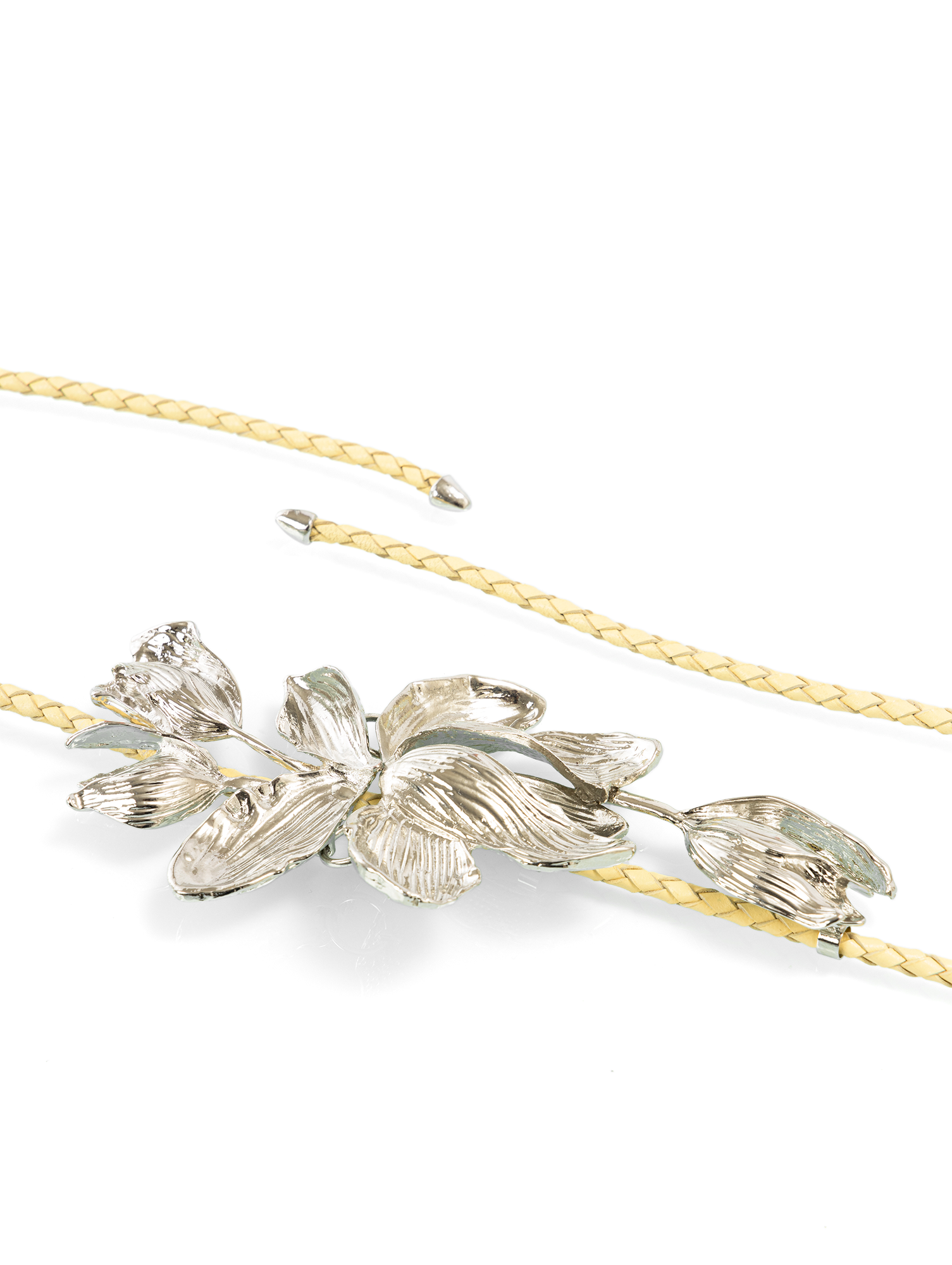 Braided belt with metal flower buckle designed as a luxury fashion waist belt for dresses and statement styling
