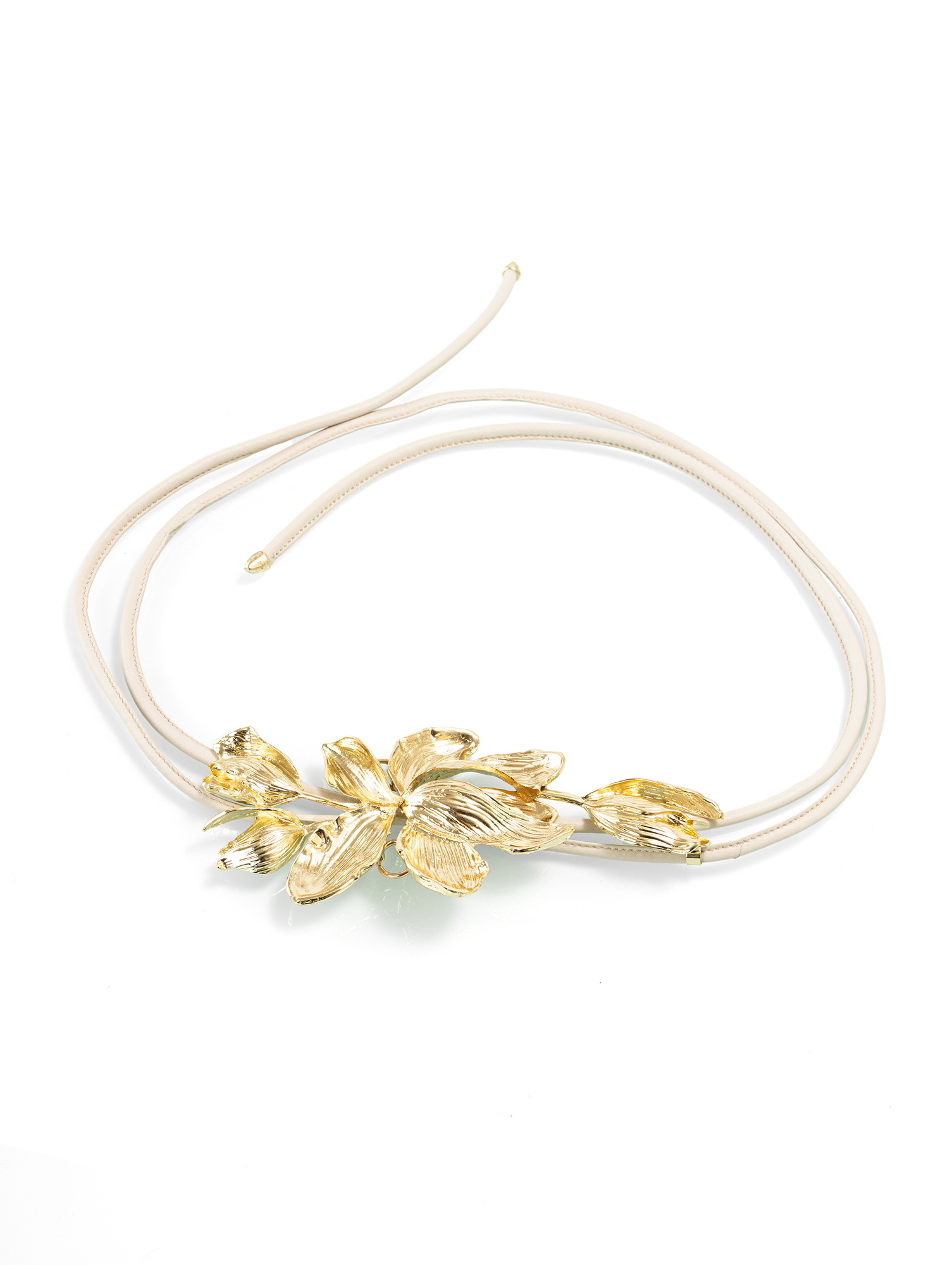 Sculptural belt featuring a delicate metal flower buckle designed to elevate modern waist styling
