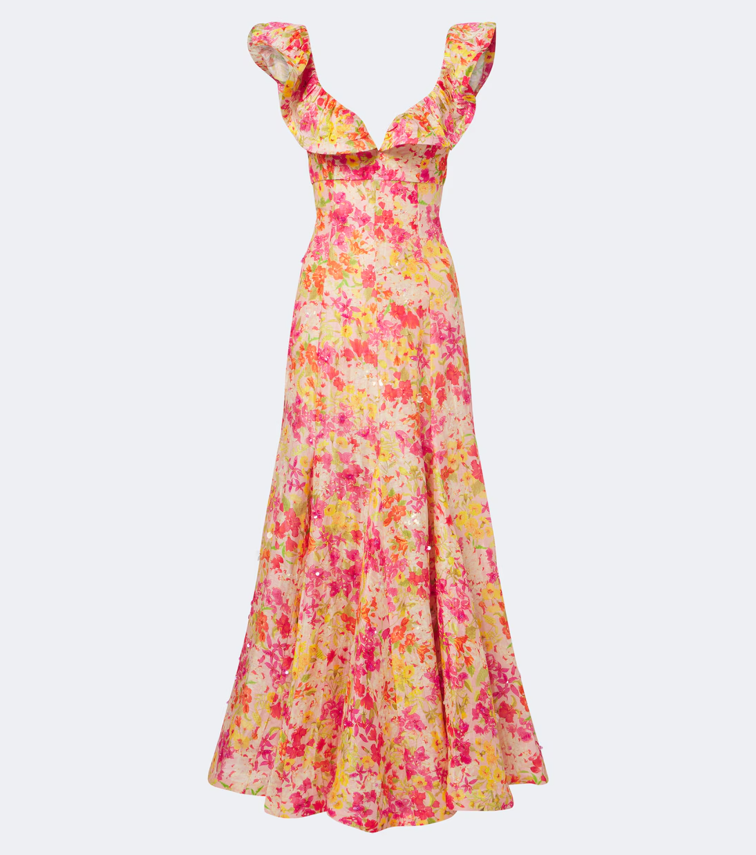 A sleeveless maxi dress with a ruffled off-the-shoulder neckline, featuring a vibrant pink, yellow, and orange floral print on a light beige background, shown against a plain light gray studio backdrop.