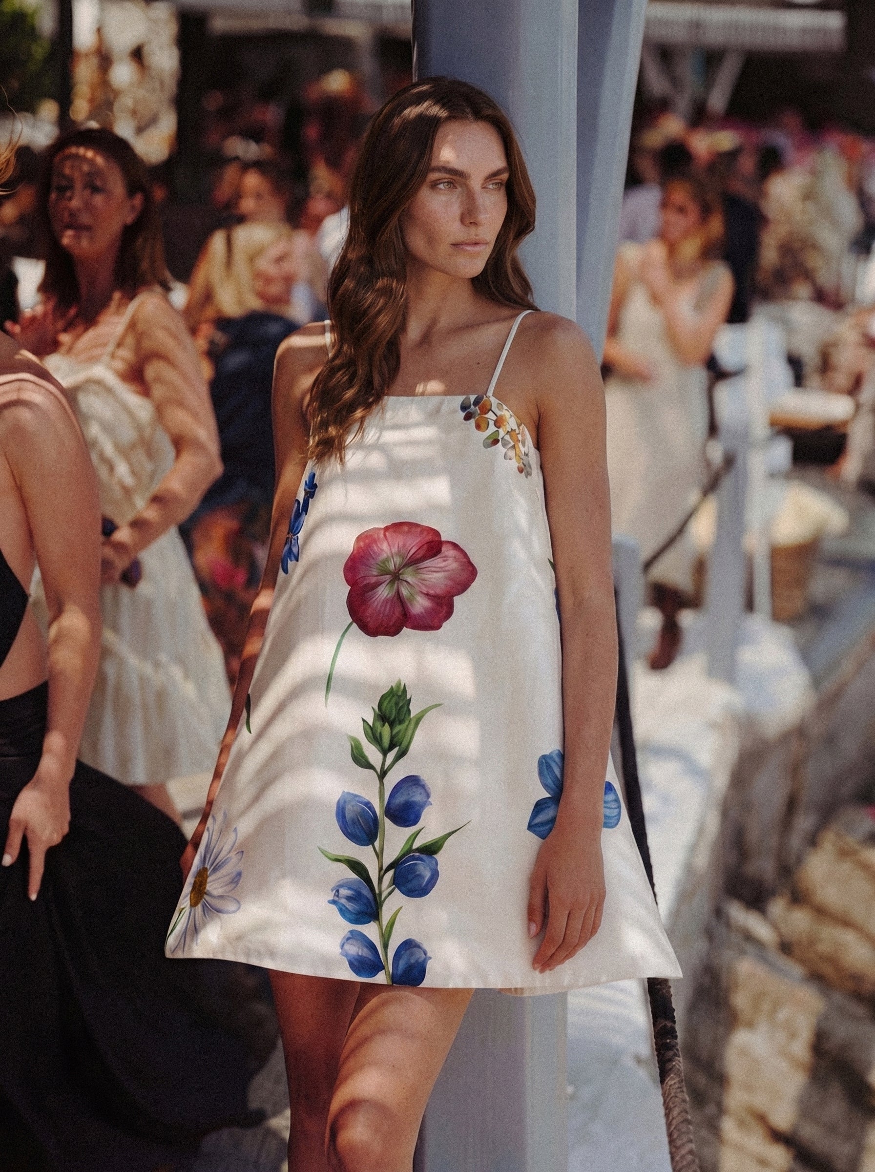 Woman wearing a floral dress at an outdoor event