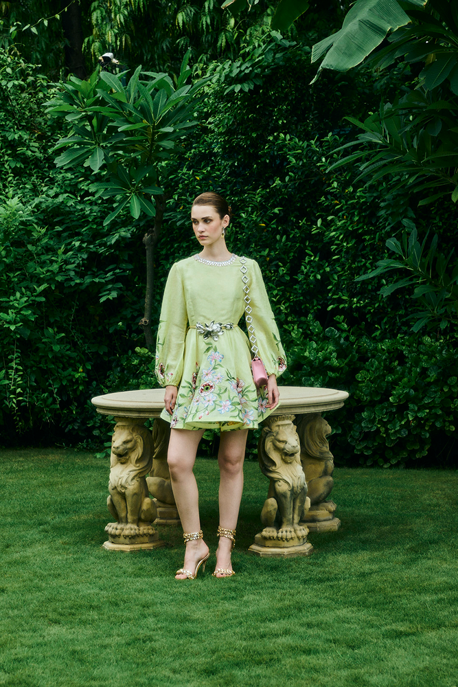 Structured A-line silhouette mini dress styled for wedding guest fashion
