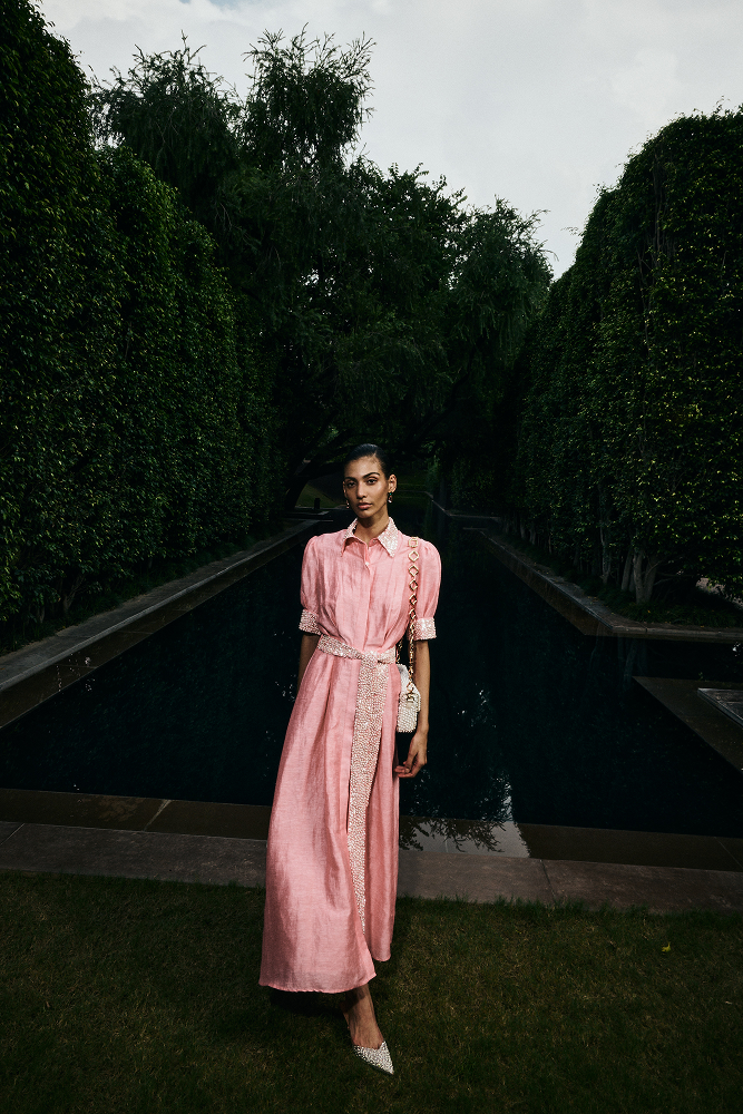 Silk linen shirt dress styled as refined garden party attire
