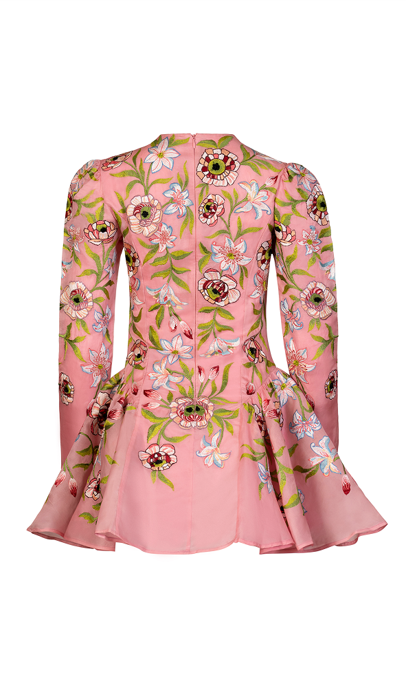 Structured A-line silhouette mini dress styled for wedding guest fashion
