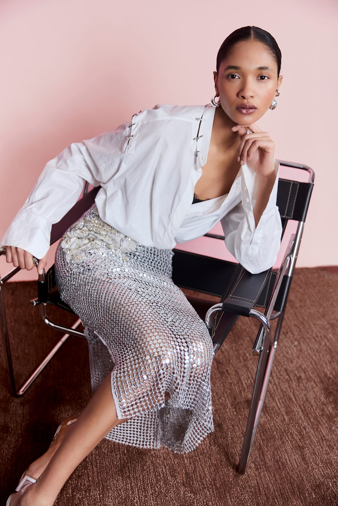 Luxury mesh skirt with hand-embellished floral detailing, artisanal silver evening wear for red carpet statement