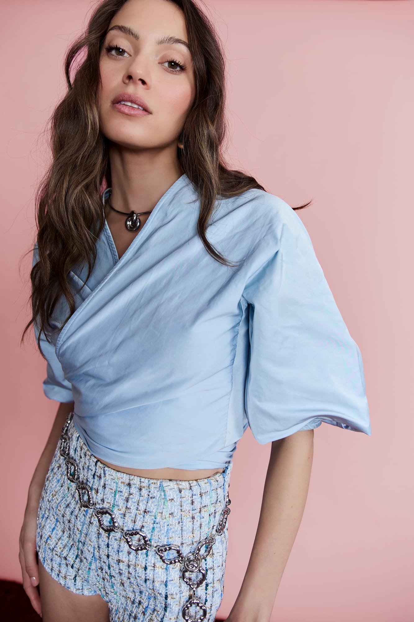 Luxury blue wrap top with voluminous sleeves, chic resort wear and modern tailored wrap shirt design