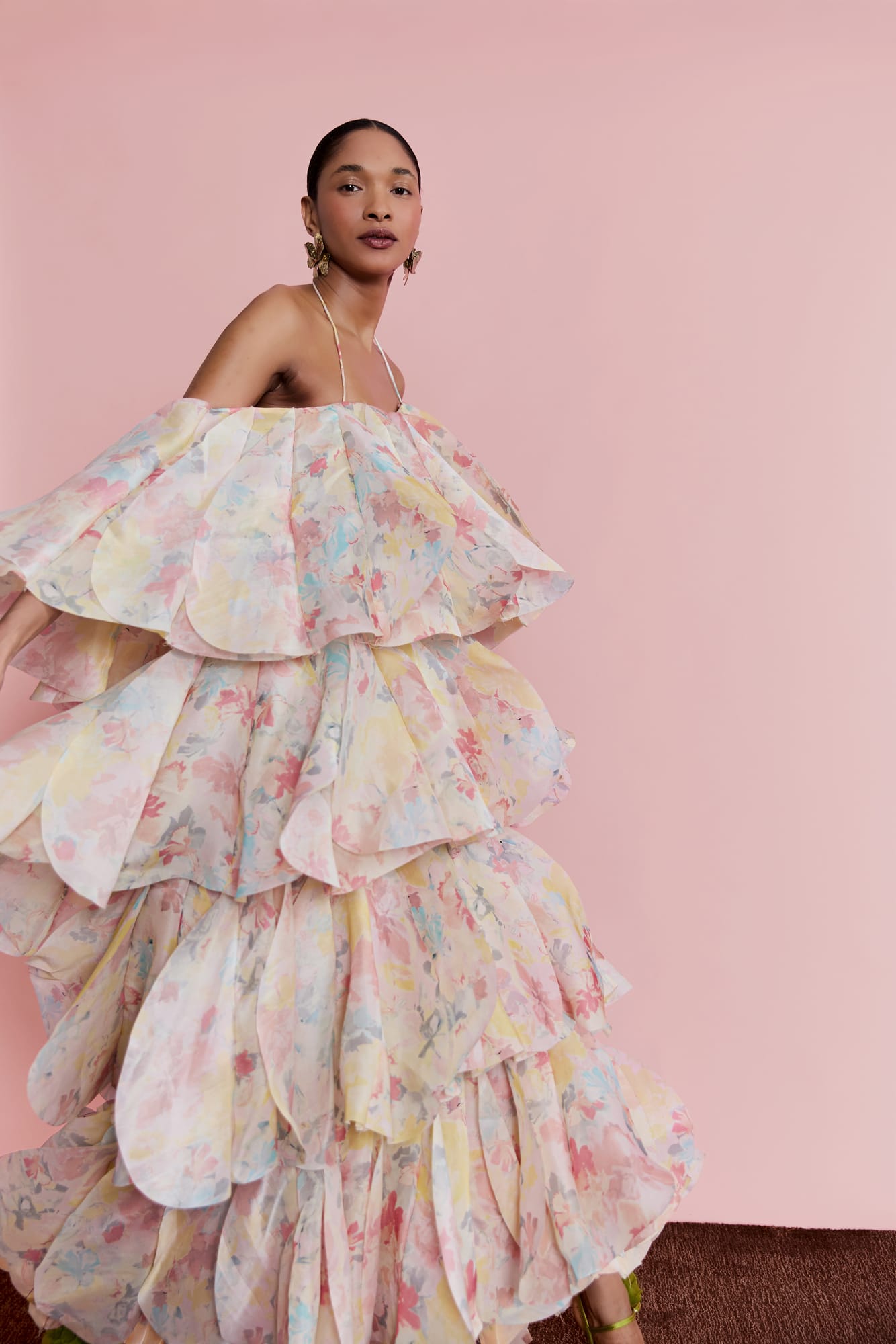 High-fashion garden wedding look, sophisticated multi-layer luxury tiered gown with floral detailing