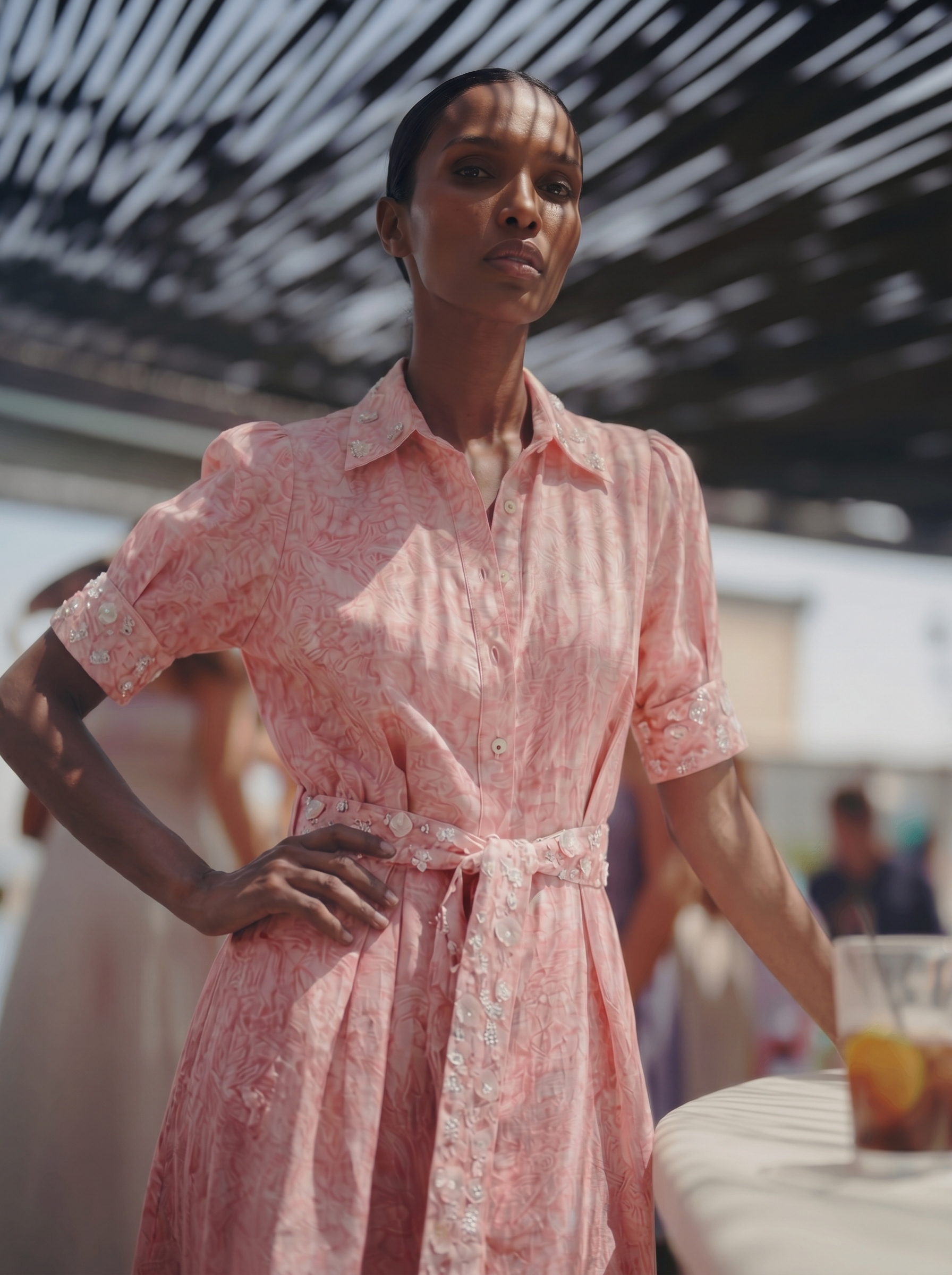 Woman wearing a pink dress with a blurred background