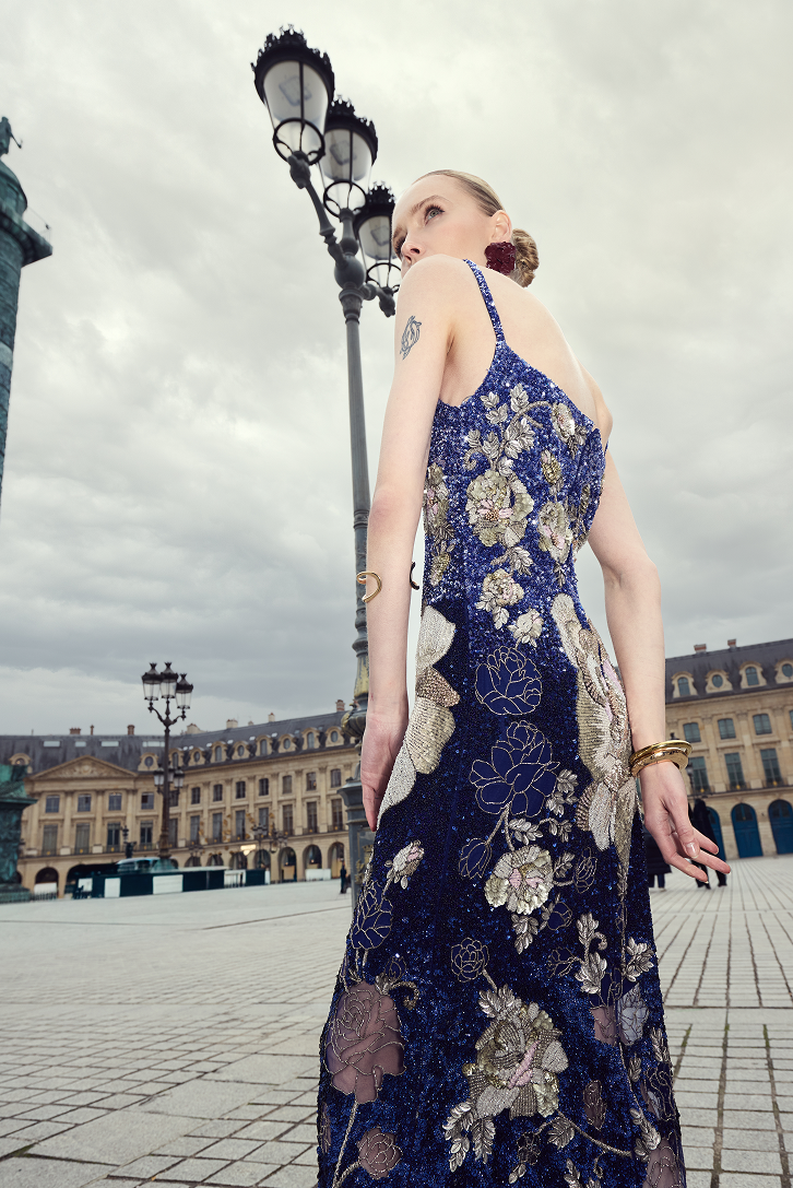 Square-neck evening dress with intricate floral detailing and a fitted column shape.