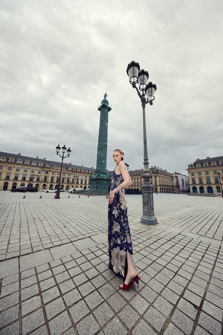 Navy blue sequin dress with a sophisticated square neckline and floor-length silhouette.