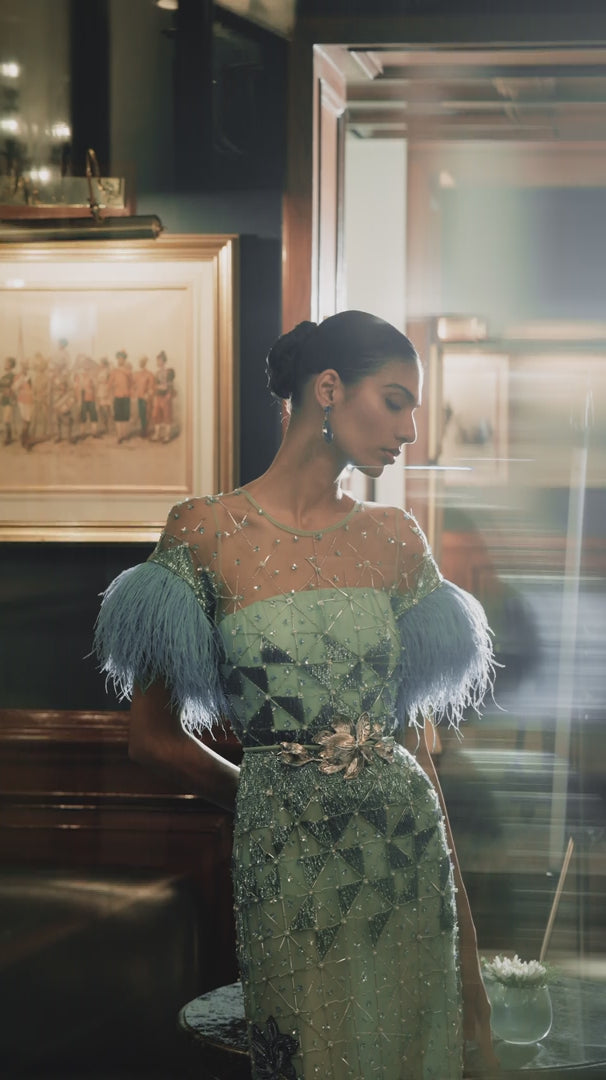 Luxury evening gown with hand-embroidered floral motifs, perfect for evening events and couture luxury wear