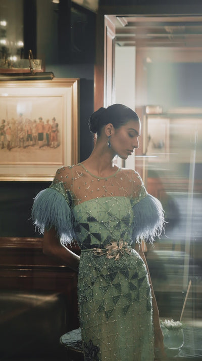 Luxury evening gown with hand-embroidered floral motifs, perfect for evening events and couture luxury wear