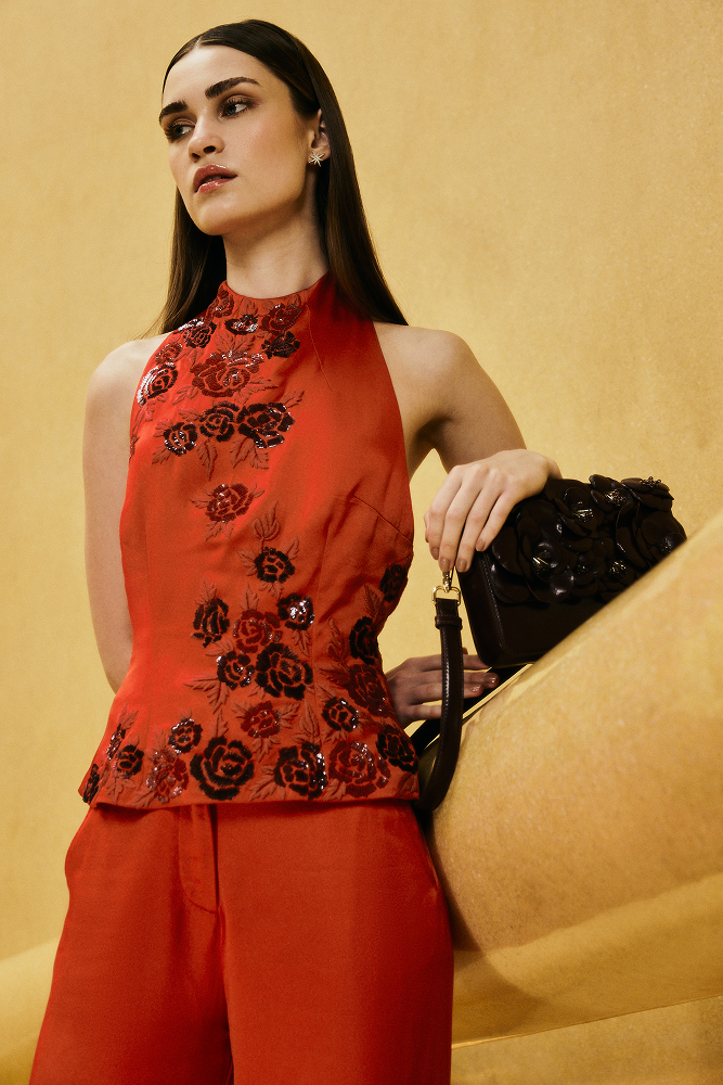 Floral embroidered top highlighted with tonal red embroidery accents
