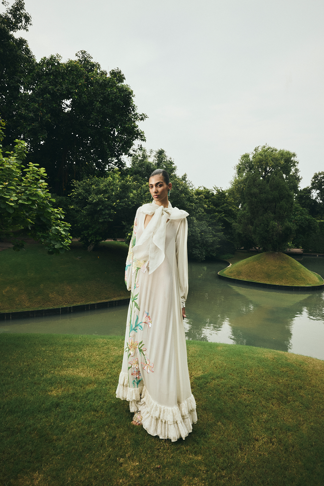 Hand-embroidered floral dress designed for luxury vacation wear
