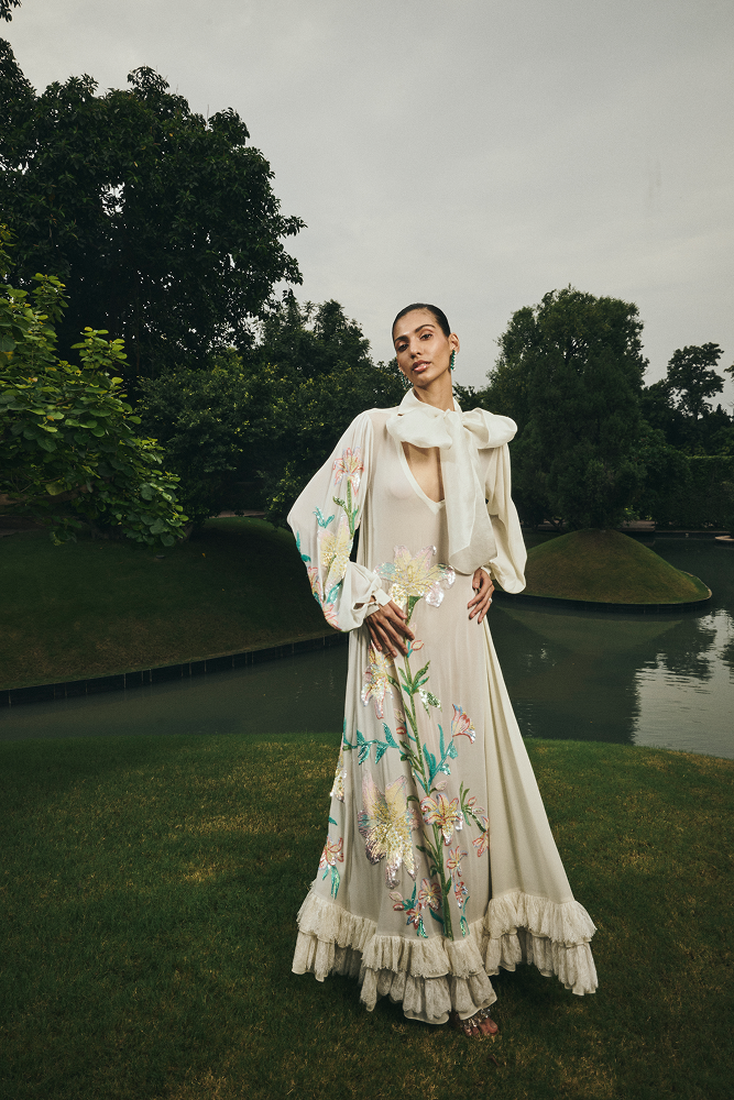 Formal day evening dress featuring sequin and threadwork design
