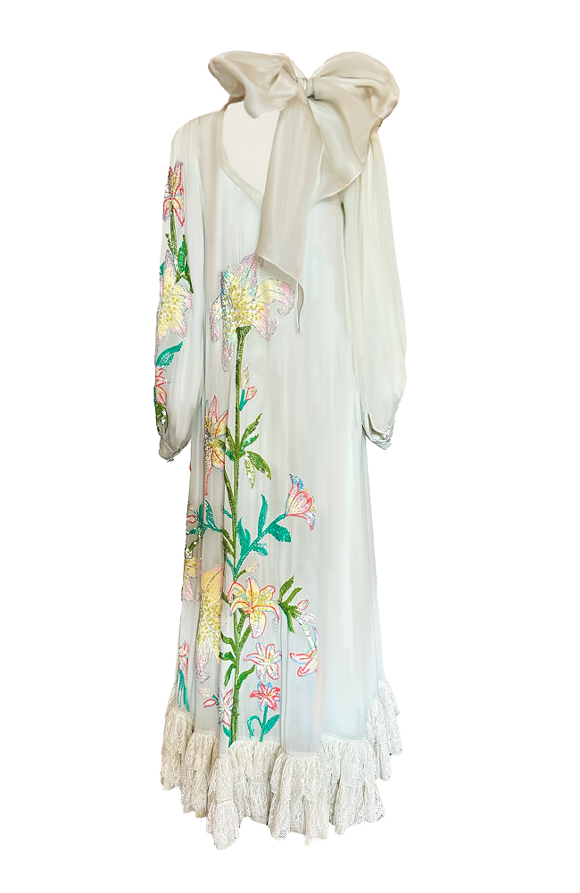 Hand-embroidered floral dress crafted for garden party couture styling
